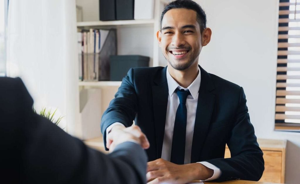 Two businessmen are shaking hands.