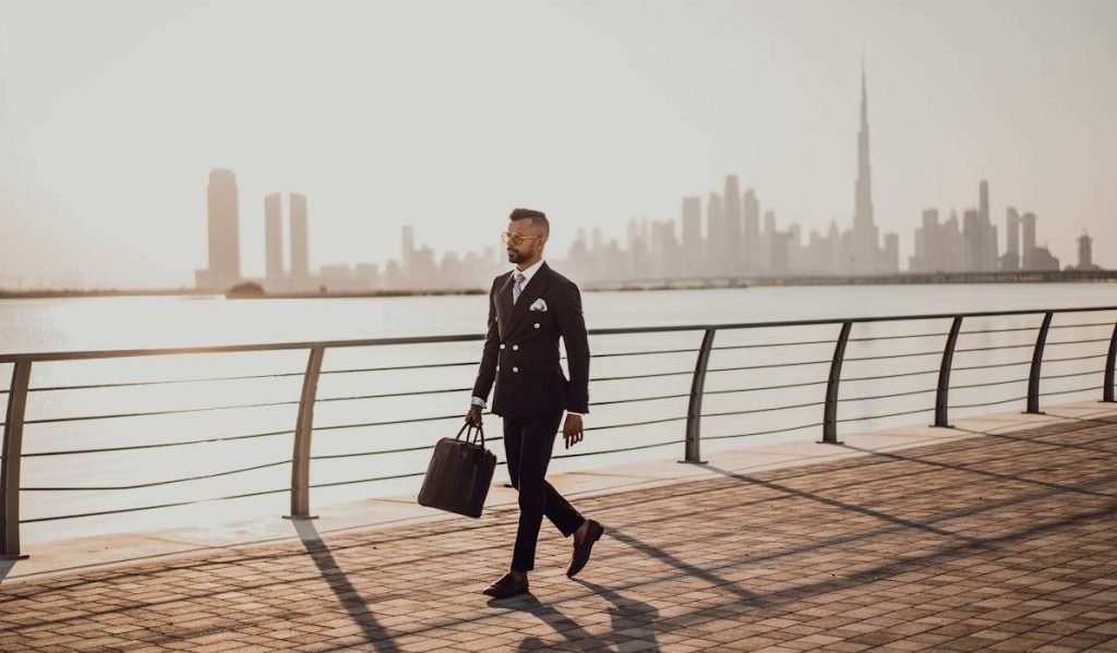 A businessman is walking in Dubai.